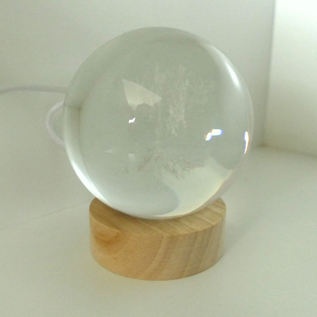 3D Crystal Ball LED Light with wooden base illuminated