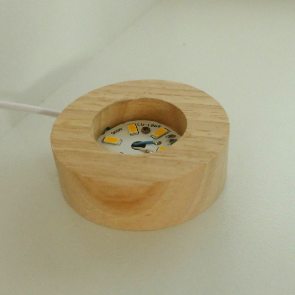 3D Crystal Ball LED Light with wooden base illuminated