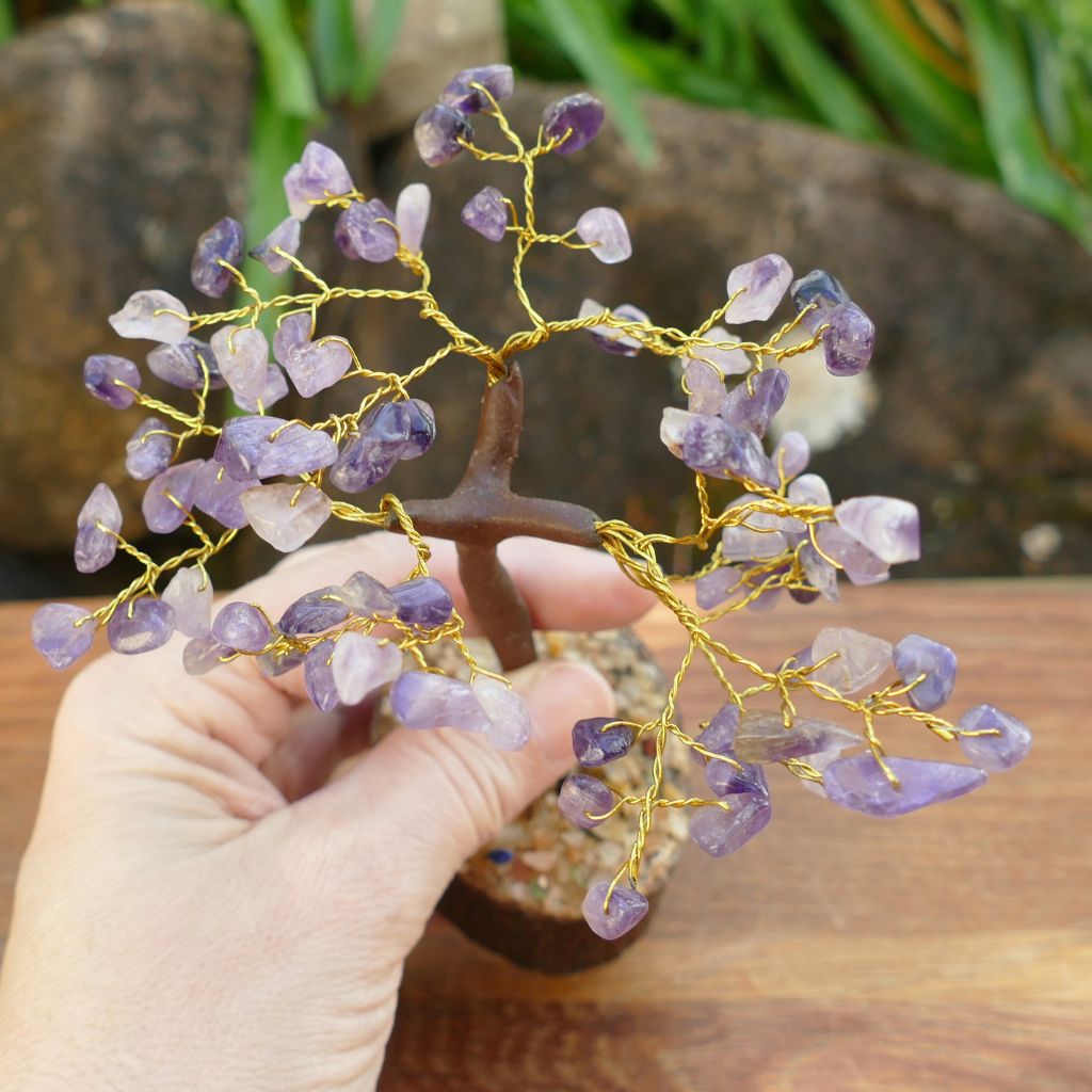 Amethyst crystal gem tree on natural wood base