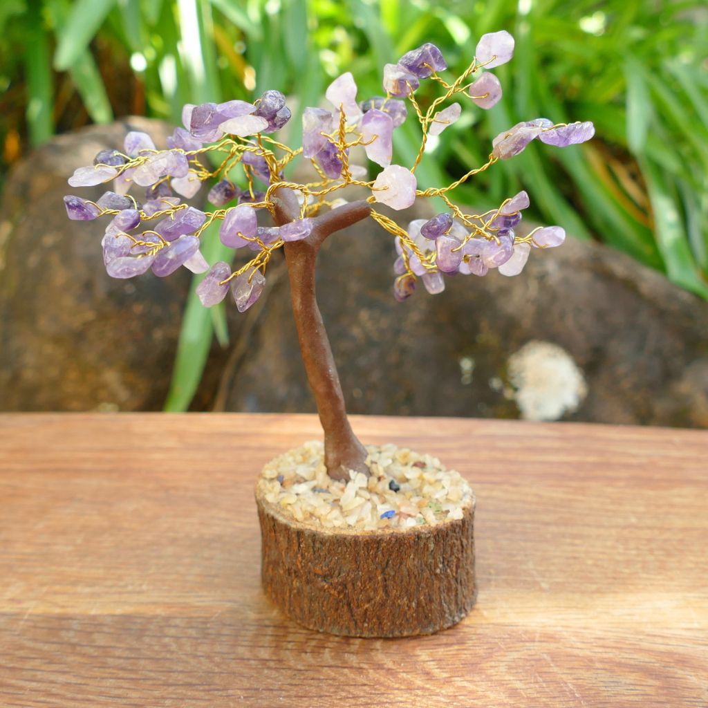 Amethyst crystal gem tree on natural wood base