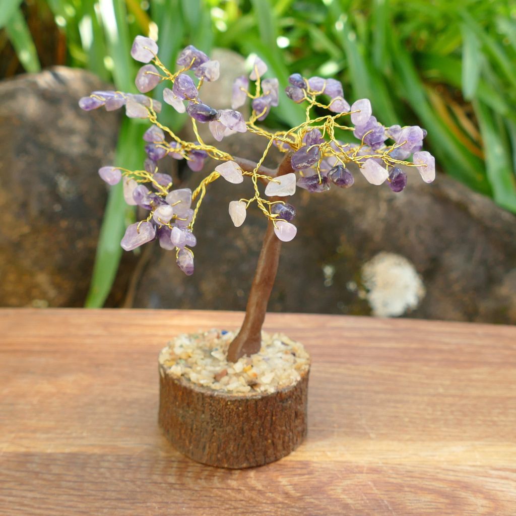 Amethyst crystal gem tree on natural wood base