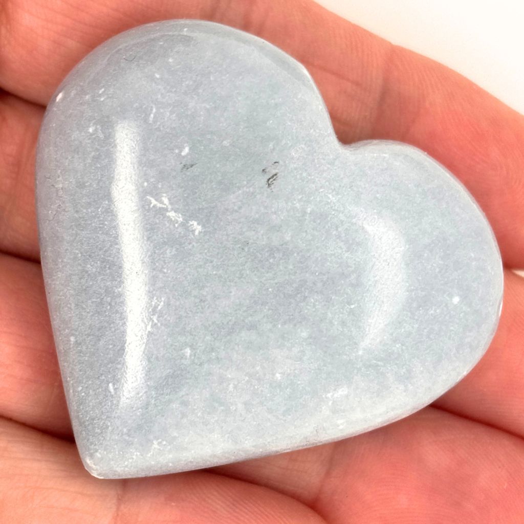 Natural polished Angelite crystal heart from Peru with soft blue colouring and a smooth finish, perfect for meditation, healing and gifting.