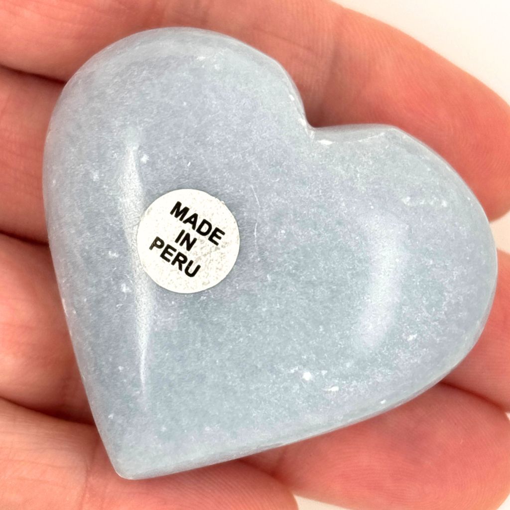 Natural polished Angelite crystal heart from Peru with soft blue colouring and a smooth finish, perfect for meditation, healing and gifting.
