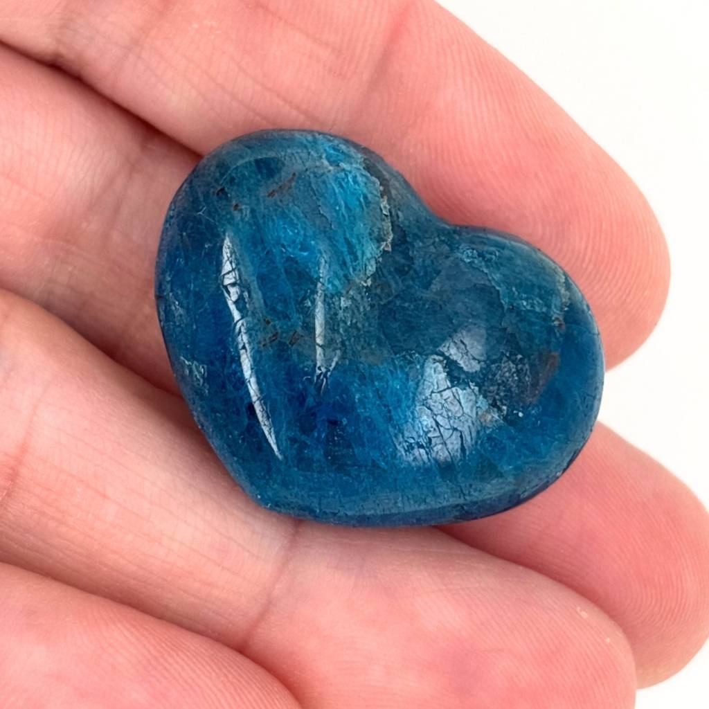 Polished blue Apatite crystal heart with vibrant ocean blue colouring
