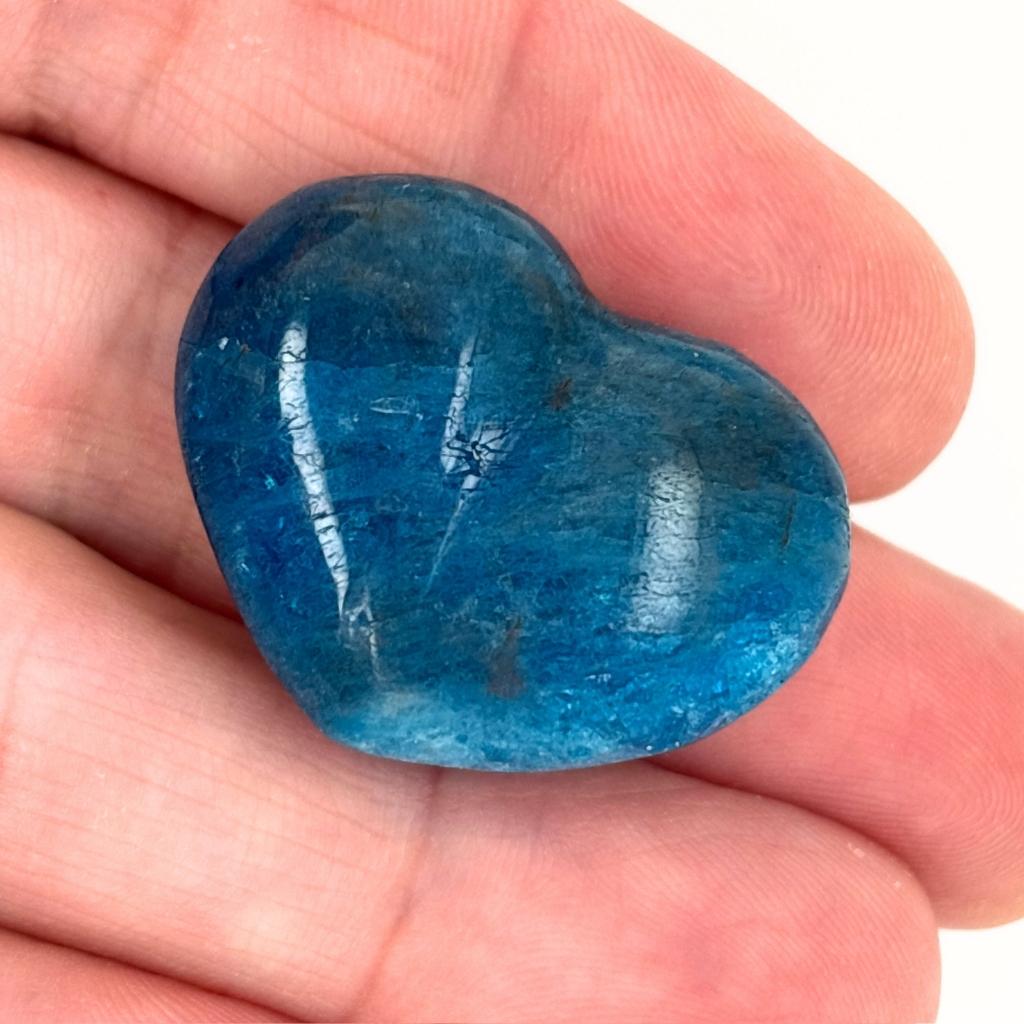 Polished blue Apatite crystal heart with vibrant ocean blue colouring