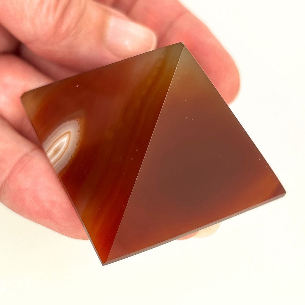 Polished Carnelian crystal pyramid with natural orange banding
