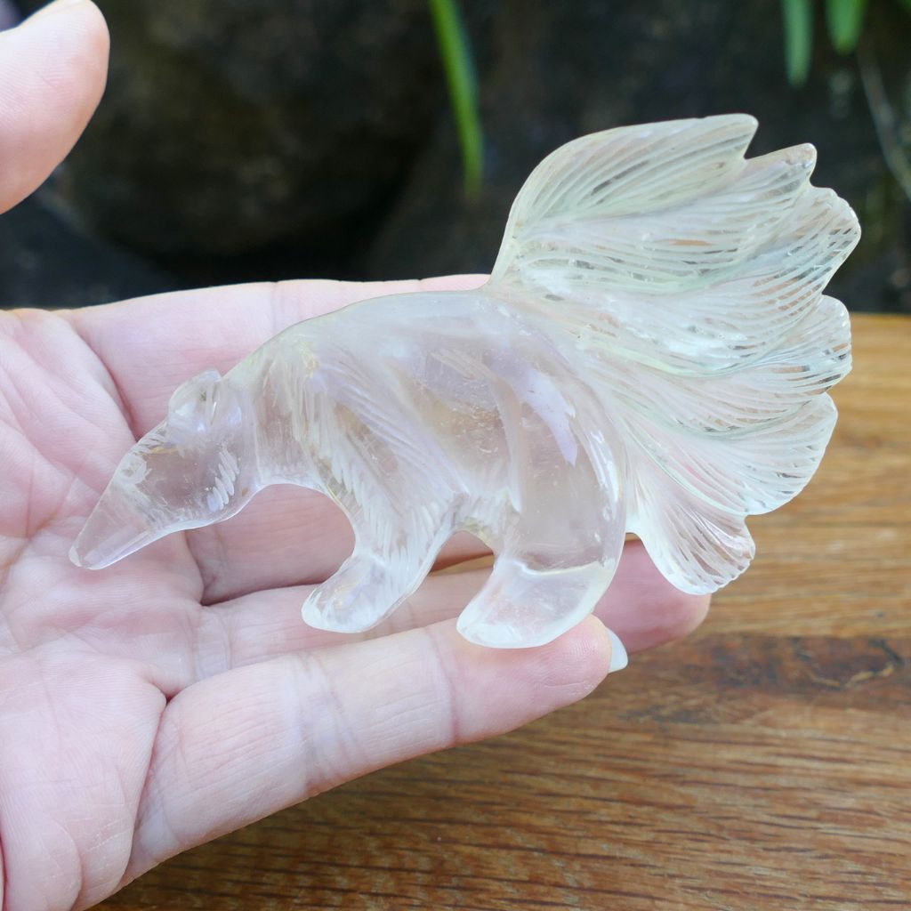 Hand carved Clear Quartz Anteater crystal carving with detailed tail and natural transparent quartz features.