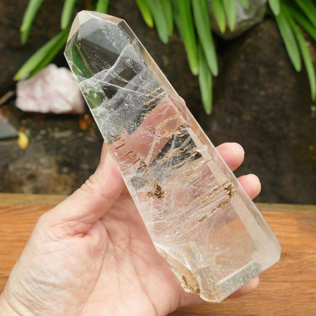 Natural Clear Quartz Crystal Point with stunning internal inclusions and polished finish.