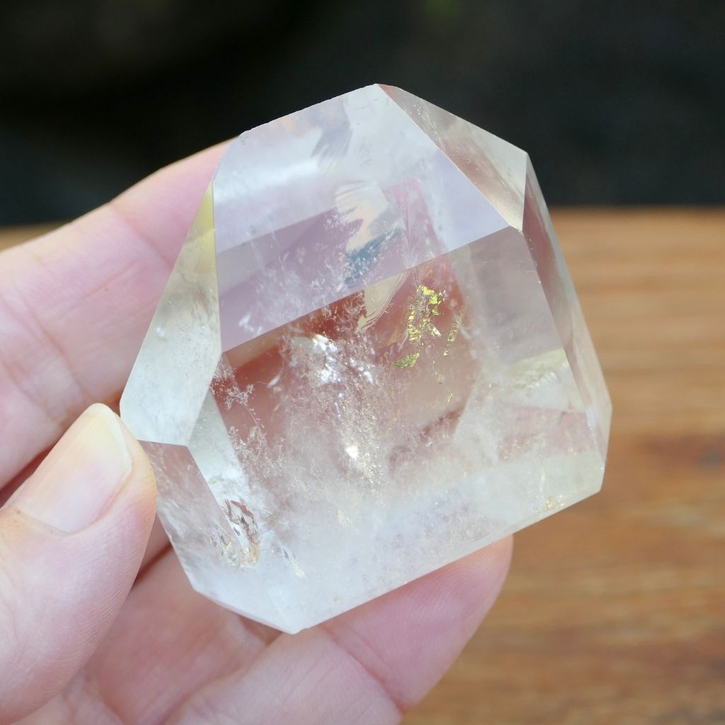 Polished Clear Quartz crystal point with natural inclusions and generator shape