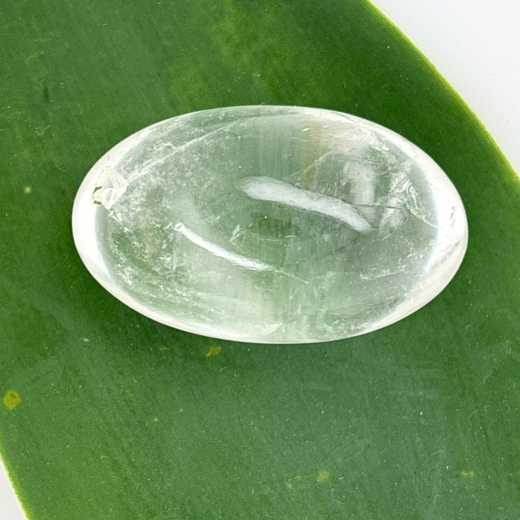 Polished Clear Quartz Lingam crystal for meditation, healing, clarity, manifestation, and energy amplification.