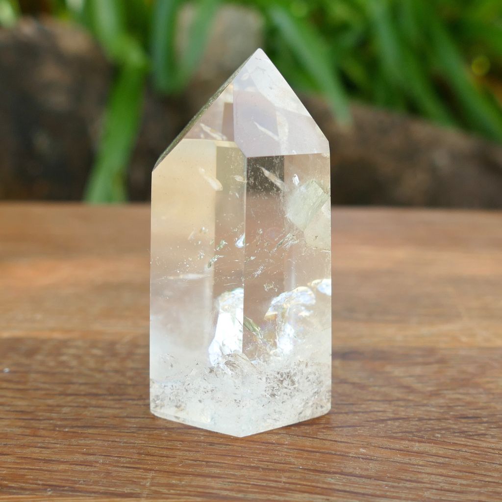 Natural Clear Quartz Point with keyhole and internal inclusions