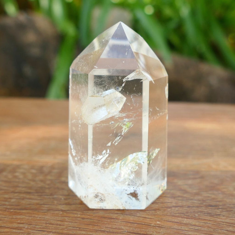 Natural Clear Quartz Point with keyhole and internal inclusions