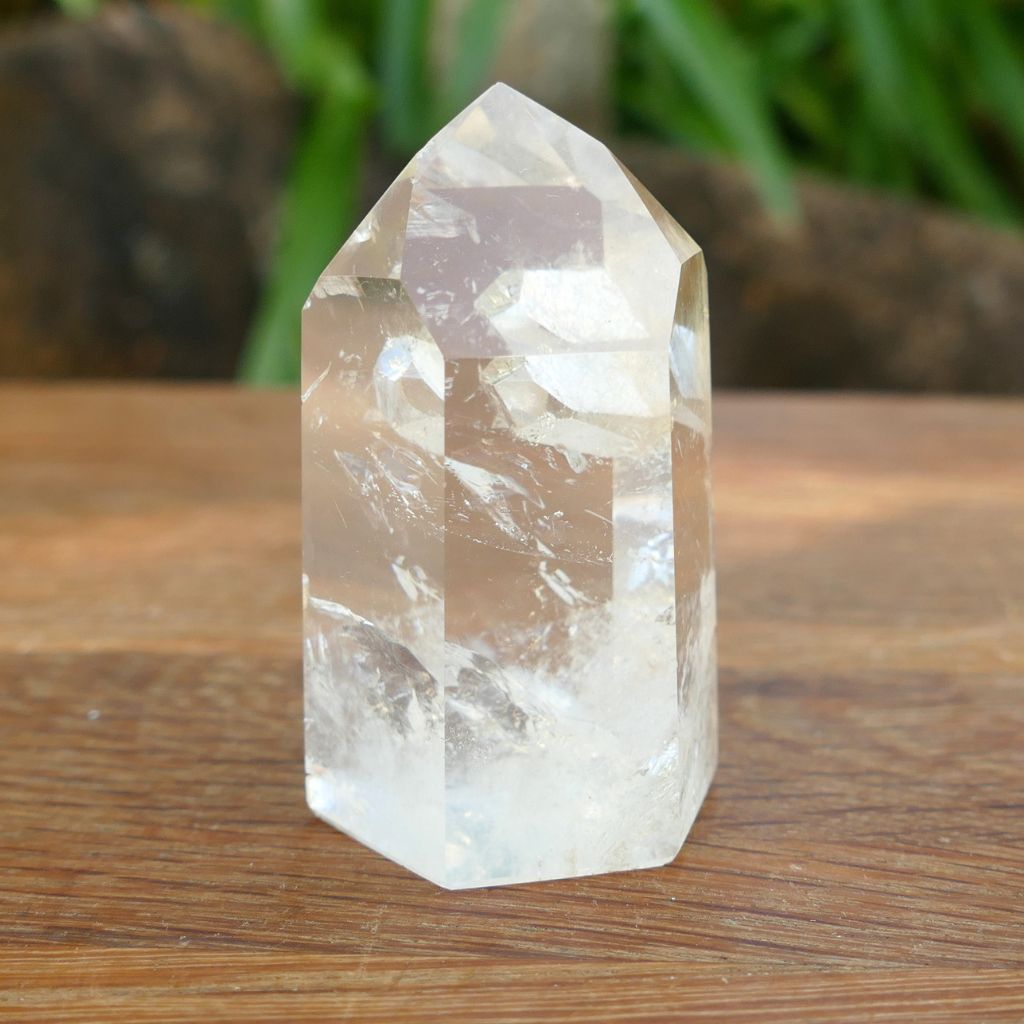Natural Clear Quartz Point with keyhole and internal inclusions