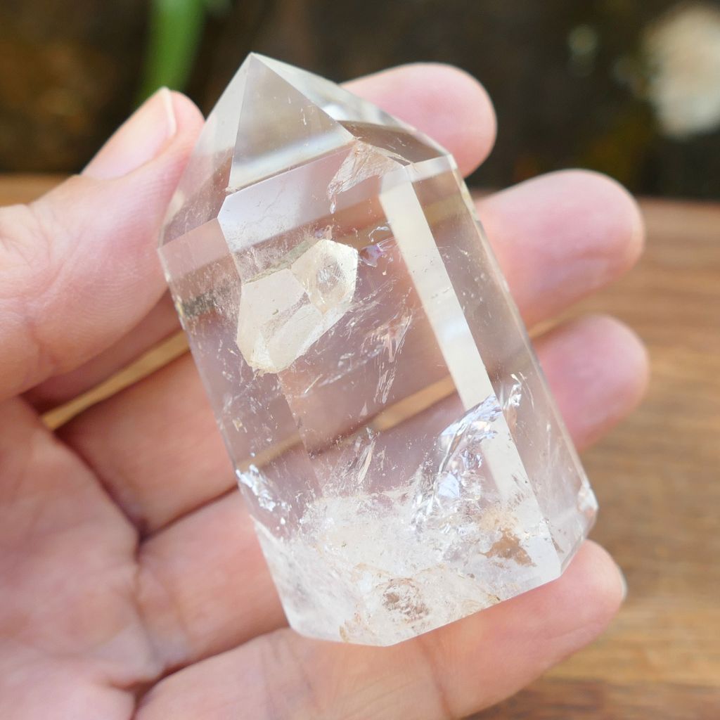Natural Clear Quartz Point with keyhole and internal inclusions