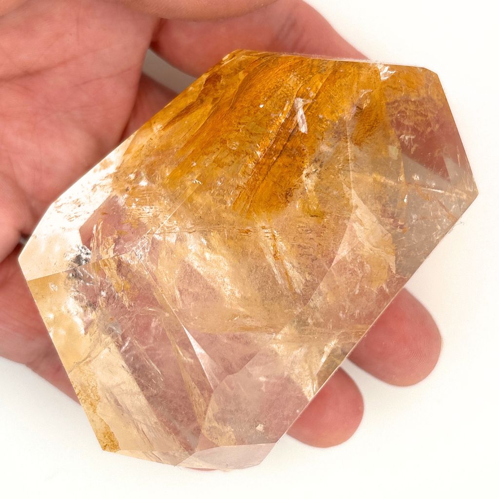 Clear Quartz polished freeform with golden brown mineral inclusions 267g