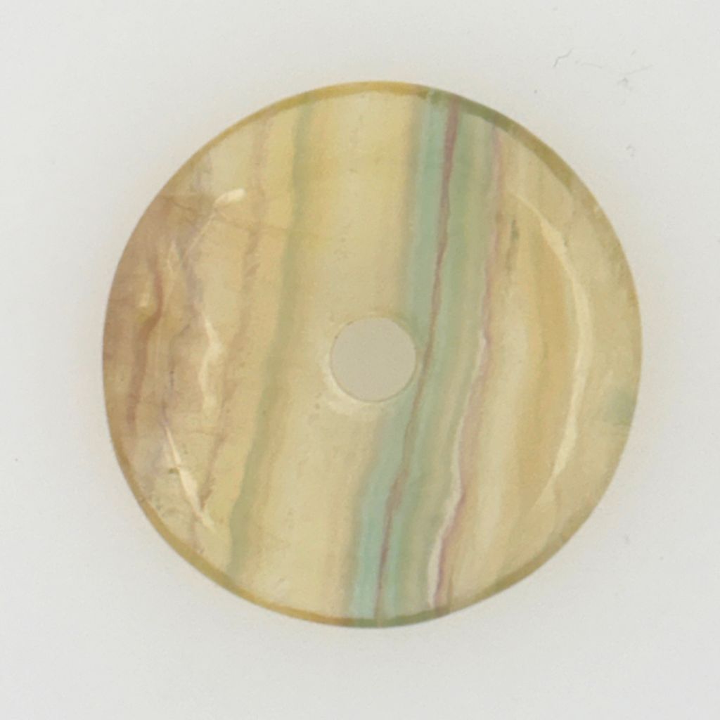 Natural Rainbow Fluorite donut pendant with green, purple and cream banding, polished into a traditional Pi disc shape.