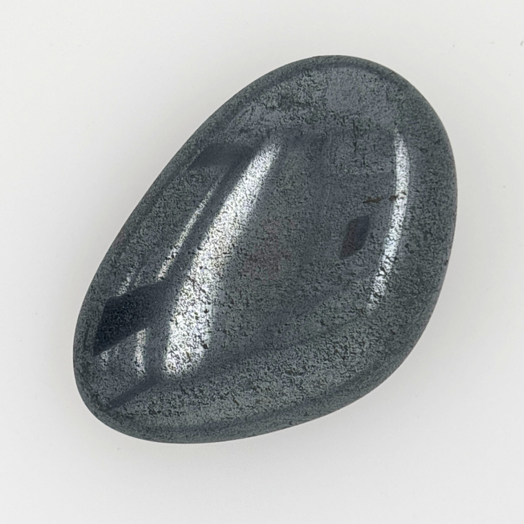 Polished hematite palm stone metallic grey grounding crystal