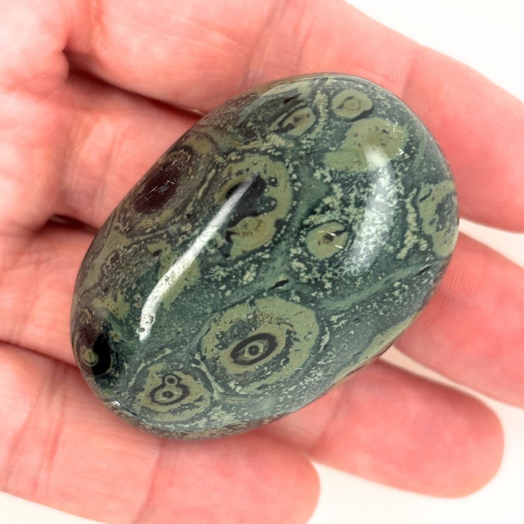 Natural Kambaba Jasper polished pebble with green and black orb patterns