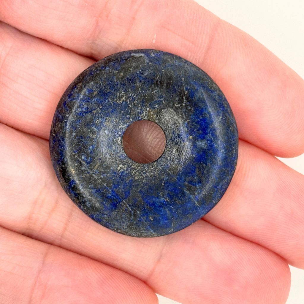 33mm natural Lapis Lazuli donut pendant with deep royal blue colouring, natural pyrite inclusions and polished Pi Disc design.