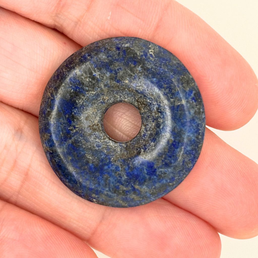 33mm natural Lapis Lazuli donut pendant with deep royal blue colouring, natural pyrite inclusions and polished Pi Disc design.