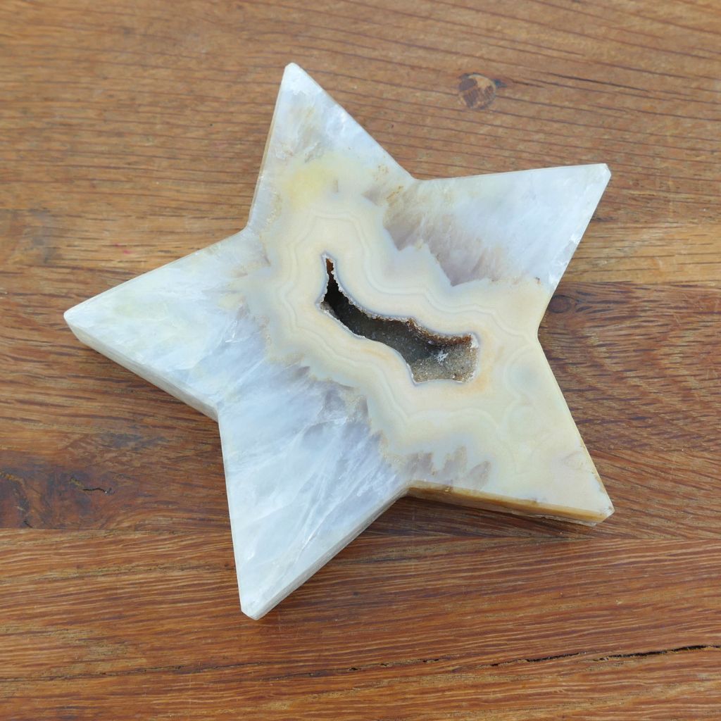Natural agate crystal star with druzy crystal cavity and cream banding