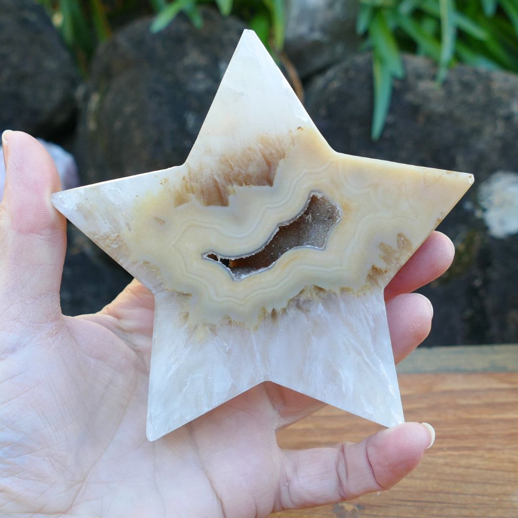Natural agate crystal star with druzy crystal cavity and cream banding