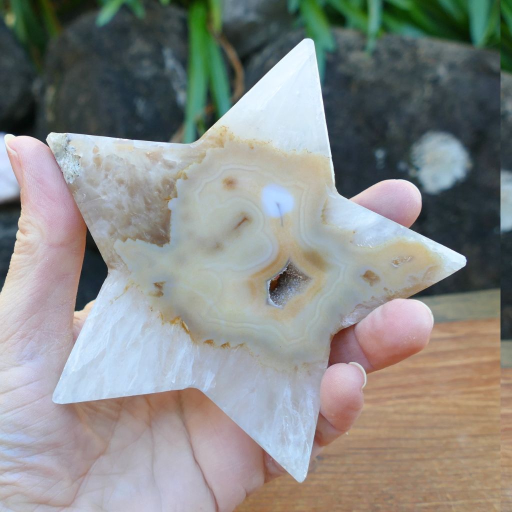 Natural agate crystal star with druzy crystal cavity and cream banding