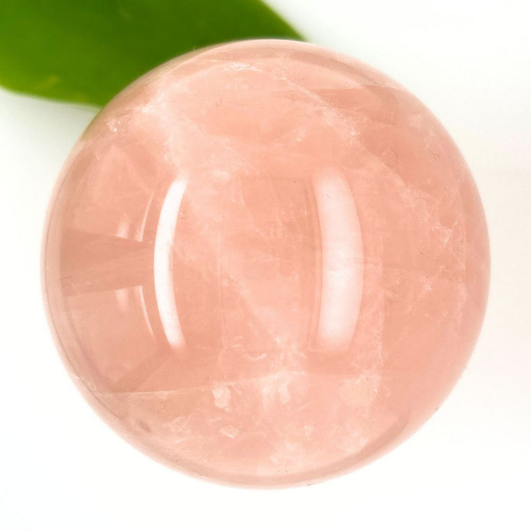Large natural Rose Quartz crystal sphere 72mm with soft pink colouring