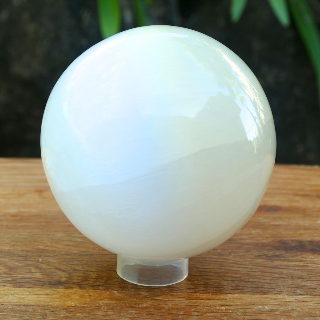 Polished white Selenite crystal sphere with soft glowing finish