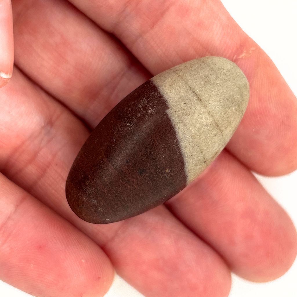 Natural Shiva Lingam Stone 40mm with brown and beige markings