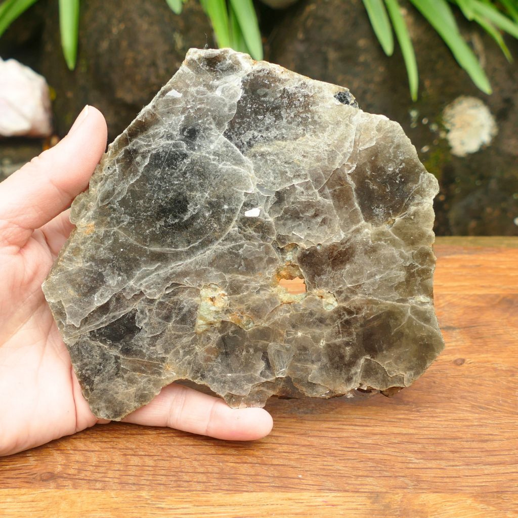 Natural Silver Muscovite Mica display specimen with layered sheet formation weighing 140g, ideal for crystal collectors and home décor.