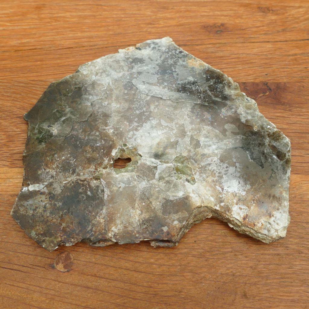 Natural Silver Muscovite Mica display specimen with layered sheet formation weighing 140g, ideal for crystal collectors and home décor.