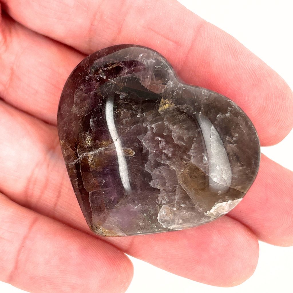 Natural Super Seven Crystal Heart with smoky grey and amethyst tones, polished healing crystal for intuition, spiritual growth and emotional balance.